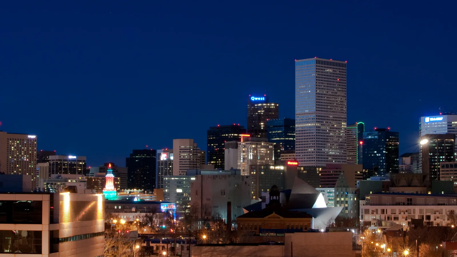 Denver skyline at blue hour, a wide modern cityscape view.